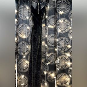 This dress is a size small but it is stretchy and fits M/L the dress has a slit.